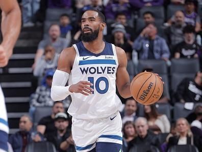 SACRAMENTO, CA - DECEMBER 23: Mike Conley #10 of the Minnesota Timberwolves brings the ball up court against the Sacramento Kings on December 23, 2023 at Golden 1 Center in Sacramento, California. NOTE TO USER: User expressly acknowledges and agrees that, by downloading and or using this Photograph, user is consenting to the terms and conditions of the Getty Images License Agreement. Mandatory Copyright Notice: Copyright 2023 NBAE (Photo by Rocky Widner/NBAE via Getty Images)