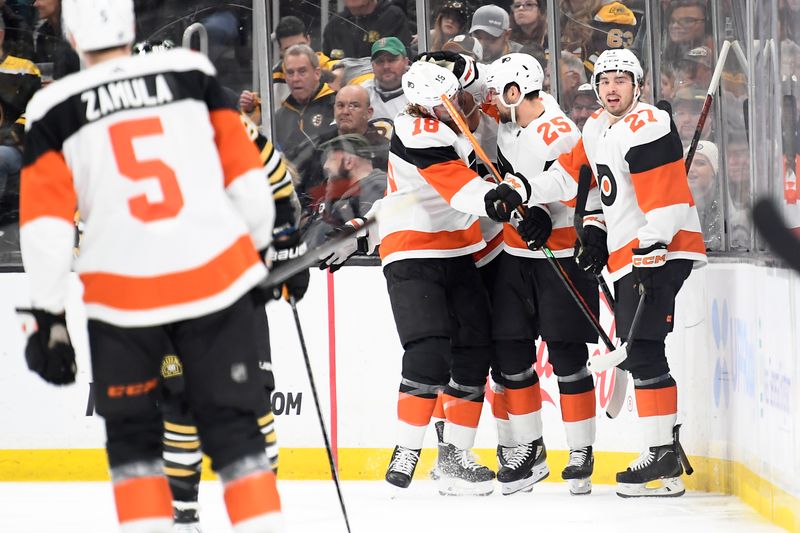 Mar 16, 2024; Boston, Massachusetts, USA; Philadelphia Flyers center Ryan Poehling (25) celebrates his goal with defenseman Marc Staal (18) and left wing Noah Cates (27) during the first period at TD Garden. Mandatory Credit: Bob DeChiara-USA TODAY Sports