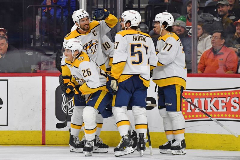 Dec 21, 2023; Philadelphia, Pennsylvania, USA; Nashville Predators center Philip Tomasino (26) celebrates his goal with teammates against the Philadelphia Flyers during the third period at Wells Fargo Center. Mandatory Credit: Eric Hartline-USA TODAY Sports