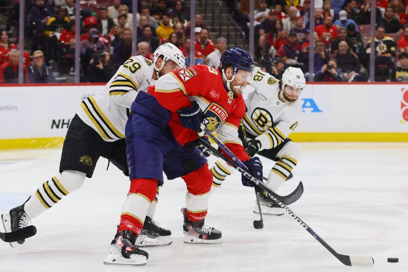 May 14, 2024; Sunrise, Florida, USA; Florida Panthers left wing Matthew Tkachuk (19) moves the puck against the Boston Bruins during the second period in game five of the second round of the 2024 Stanley Cup Playoffs at Amerant Bank Arena. Mandatory Credit: Sam Navarro-USA TODAY Sports