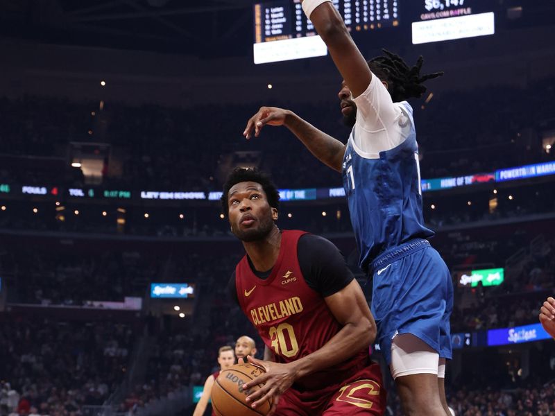 CLEVELAND, OH - March 8: Damian Jones #30 of the Cleveland Cavaliers handles the ball during the game against the Minnesota Timberwolves on March 8, 2024 at Rocket Mortgage FieldHouse in Cleveland, Ohio. NOTE TO USER: User expressly acknowledges and agrees that, by downloading and/or using this Photograph, user is consenting to the terms and conditions of the Getty Images License Agreement. Mandatory Copyright Notice: Copyright 2024 NBAE (Photo by Lauren Leigh Bacho/NBAE via Getty Images)