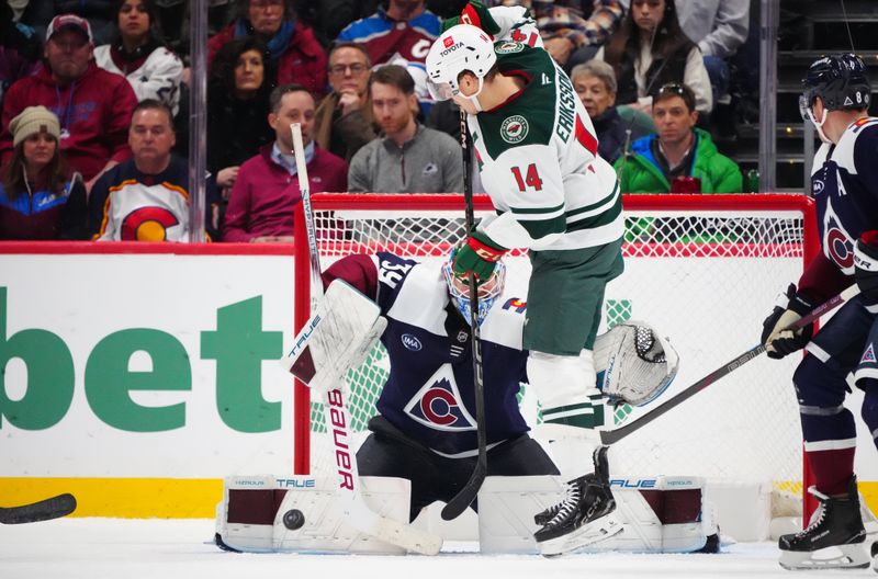 Jan 20, 2025; Denver, Colorado, USA; Colorado Avalanche goaltender Mackenzie Blackwood (39) makes a save on Minnesota Wild center Joel Eriksson Ek (14) in the second period at Ball Arena. Mandatory Credit: Ron Chenoy-Imagn Images