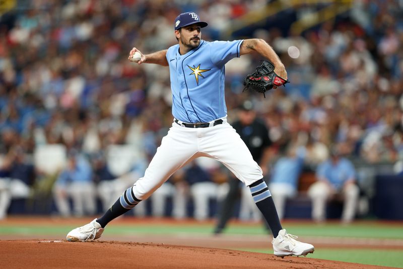 Jul 9, 2023; St. Petersburg, Florida, USA;   Tampa Bay Rays starting pitcher Zach Eflin (24) throws a pitch against the Atlanta Braves in the first inning at Tropicana Field. Mandatory Credit: Nathan Ray Seebeck-USA TODAY Sports