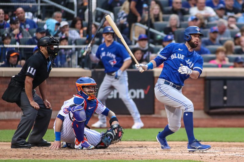 Jun 3, 2023; New York City, New York, USA;  Toronto Blue Jays designated hitter Brandon Belt (13) hits a double in the sixth inning against the New York Mets at Citi Field. Mandatory Credit: Wendell Cruz-USA TODAY Sports