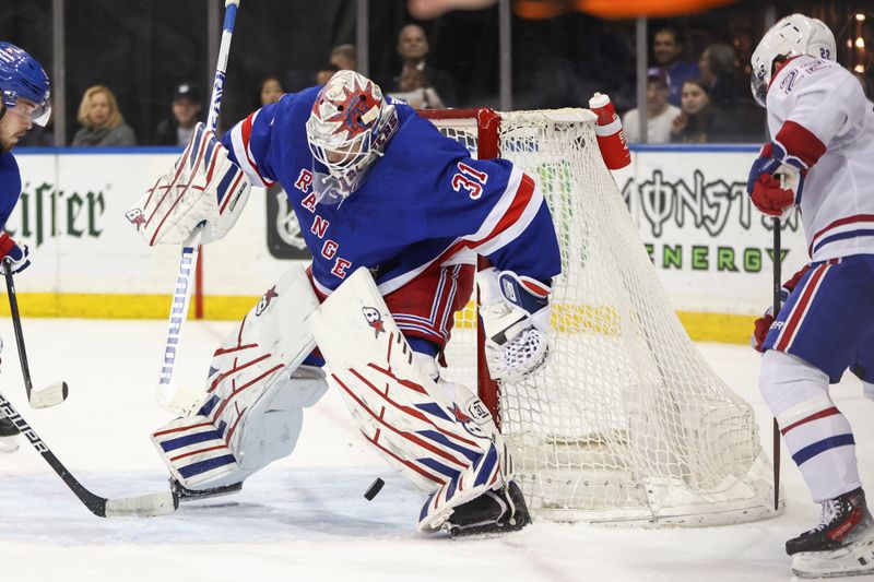 Apr 7, 2024; New York, New York, USA;   Montreal Canadiens right wing Cole Caufield (22) scores a goal against New York Rangers goaltender Igor Shesterkin (31) in the first period at Madison Square Garden. Mandatory Credit: Wendell Cruz-USA TODAY Sports