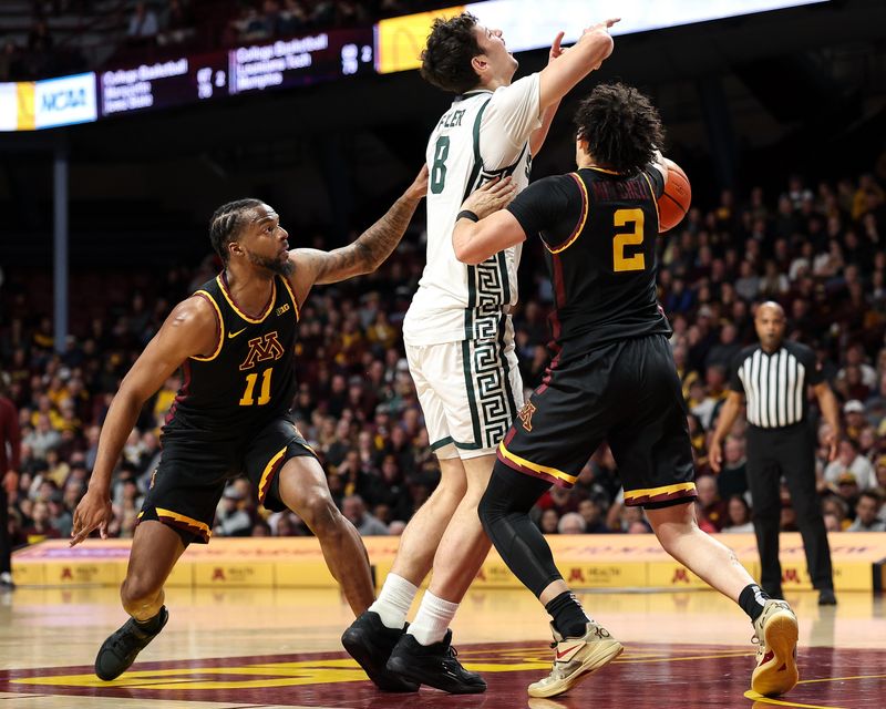 Dec 4, 2024; Minneapolis, Minnesota, USA; Minnesota Golden Gophers guard Mike Mitchell Jr. (2) steals the ball from Michigan State Spartans forward Frankie Fidler (8) during the second half at Williams Arena. Mandatory Credit: Matt Krohn-Imagn Images