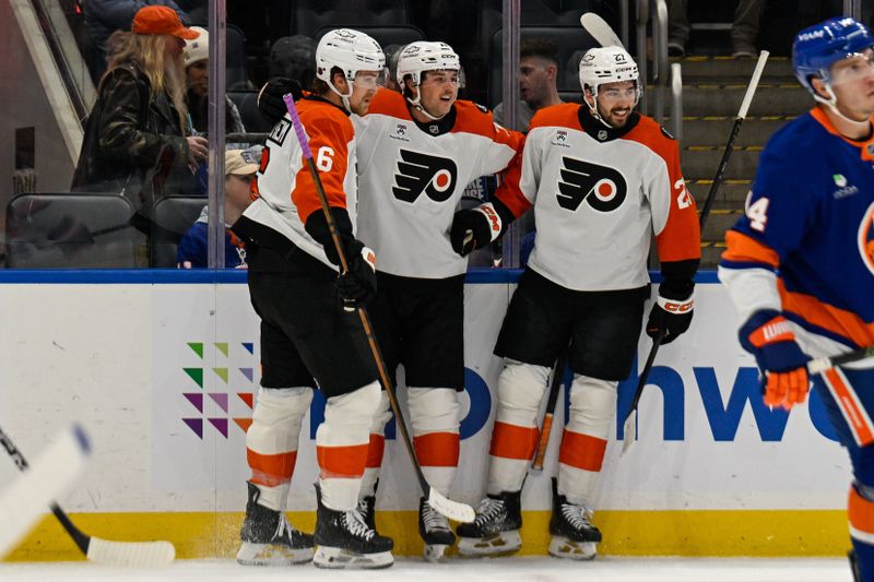 Nov 28, 2025; Elmont, New York, USA; Philadelphia Flyers right wing Tyson Foerster (71) celebrates his goal with Philadelphia Flyers defenseman Travis Sanheim (6) and Philadelphia Flyers center Christian Dvorak (22) against the New York Islanders during the first period at UBS Arena. Mandatory Credit: Dennis Schneidler-Imagn Images