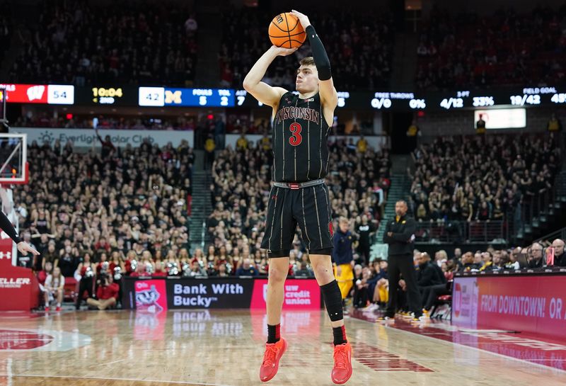 Feb 14, 2023; Madison, Wisconsin, USA;  Wisconsin Badgers guard Connor Essegian (3) shoots a three-pointer during the second half against the Michigan Wolverines at the Kohl Center. Mandatory Credit: Kayla Wolf-USA TODAY Sports