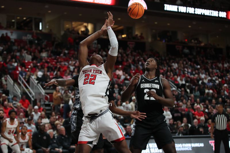 Nov 30, 2022; Lubbock, Texas, USA;  Texas Tech Red Raiders guard Elijah Fisher (22) loses the ball in front of Georgetown Hoyas forward Bradley Ezewiro (22) in the second half at United Supermarkets Arena. Mandatory Credit: Michael C. Johnson-USA TODAY Sports