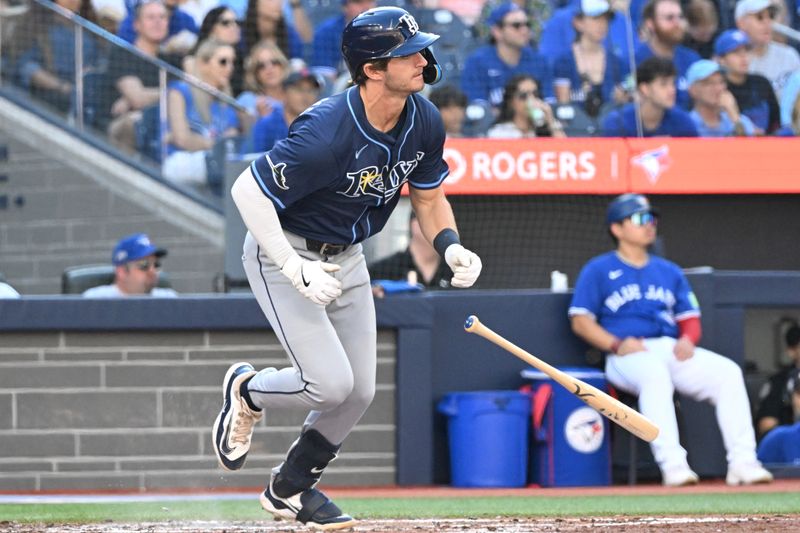 Sep 28, 2025; Toronto, Ontario, CAN;  Tampa Bay Rays shortstop Carson Williams (7) hits a single against the Toronto Blue Jays in the fourth inning at Rogers Centre. Mandatory Credit: Dan Hamilton-Imagn Images