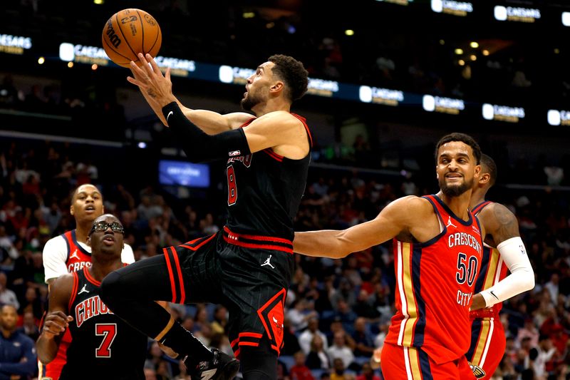 NEW ORLEANS, LOUISIANA - OCTOBER 23: Zach LaVine #8 of the Chicago Bulls shoots over Jeremiah Robinson-Earl #50 of the New Orleans Pelicans during the second quarter of an NBA game at Smoothie King Center on October 23, 2024 in New Orleans, Louisiana. NOTE TO USER: User expressly acknowledges and agrees that, by downloading and or using this photograph, User is consenting to the terms and conditions of the Getty Images License Agreement. (Photo by Sean Gardner/Getty Images)