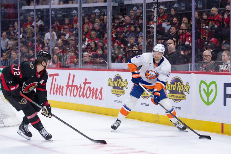 Mar 19, 2026; Ottawa, Ontario, CAN; New York Islanders defenseman Adam Pelech (3) controls the puck as Ottawa Senators defenseman Thomas Chabot (72) defends in the second period at the Canadian Tire Centre. Mandatory Credit: Marc DesRosiers-IMAGN Images