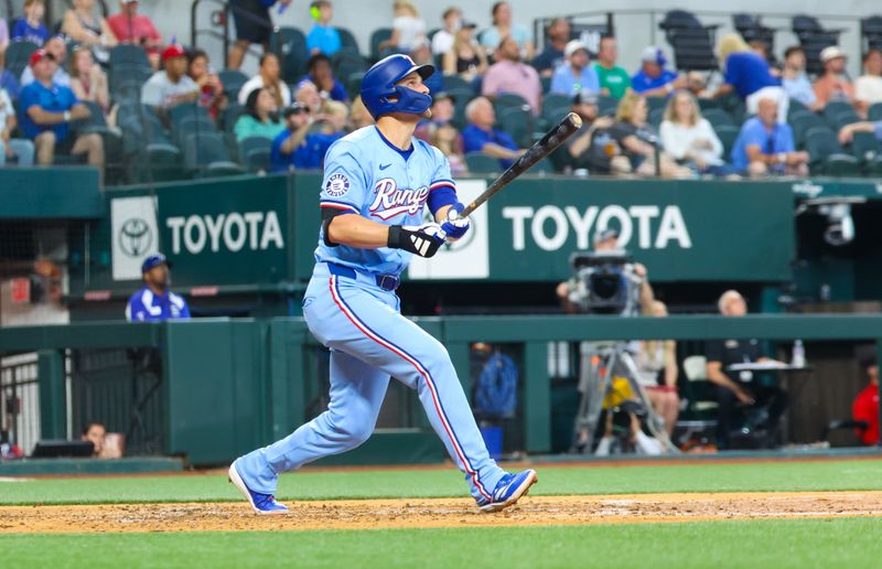 May 19, 2024; Arlington, Texas, USA; Texas Rangers shortstop Corey Seager (5) hits a home run during the fourth inning against the Los Angeles Angels at Globe Life Field. Mandatory Credit: Kevin Jairaj-USA TODAY Sports