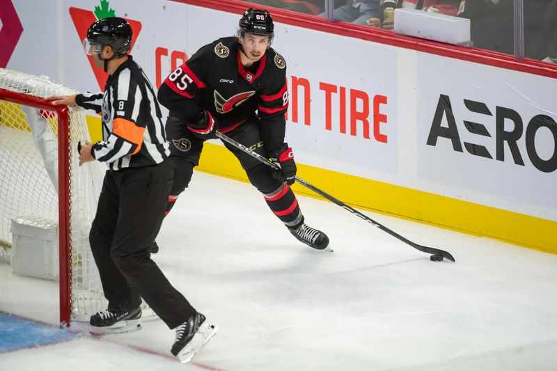 Oct 14, 2023; Ottawa, Ontario, CAN; Ottawa Senators defenseman Jake Sanderson (85) skates with the puck in the third period against the Philadelphia Flyers  at the Canadian Tire Centre. Mandatory Credit: Marc DesRosiers-USA TODAY Sports