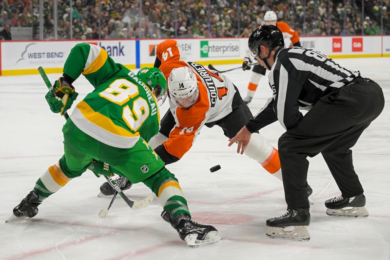 Dec 14, 2024; Saint Paul, Minnesota, USA;  Minnesota Wild forward Frederick Gaudreau (89) and Philadelphia Flyers forward Sean Couturier (14) face-off during the third period at Xcel Energy Center. Mandatory Credit: Nick Wosika-Imagn Images
