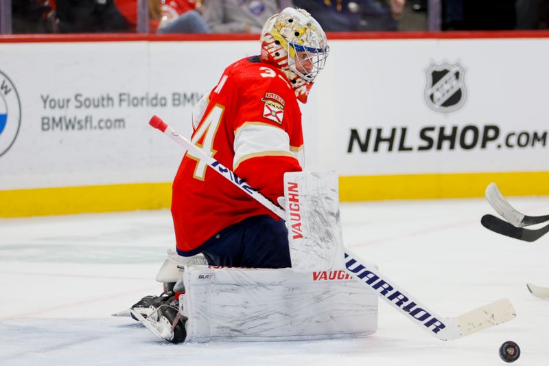 Apr 4, 2023; Sunrise, Florida, USA; Florida Panthers goaltender Alex Lyon (34) makes a save during the first period against the Buffalo Sabres at FLA Live Arena. Mandatory Credit: Sam Navarro-USA TODAY Sports