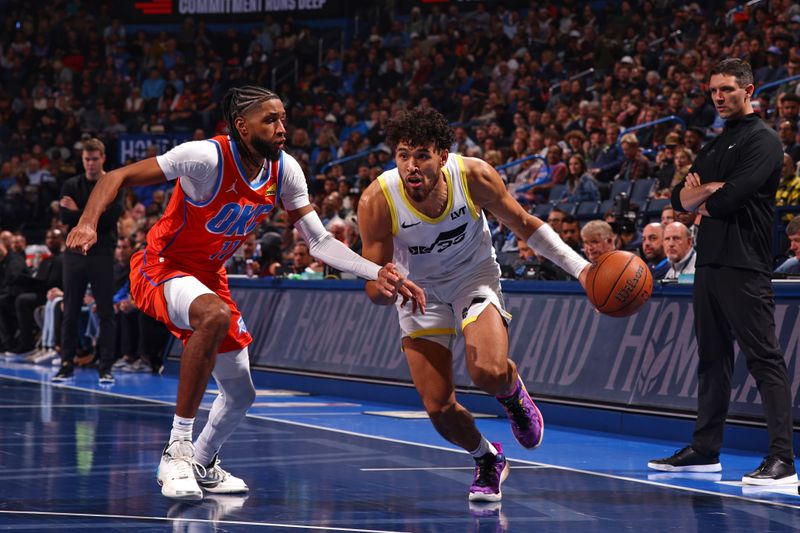 OKLAHOMA CITY, OK - DECEMBER 3: Johnny Juzang #33 of the Utah Jazz drives to the basket during the game against the Oklahoma City Thunder during the Emirates NBA Cup game on on December 3, 2024 at Paycom Center in Oklahoma City, Oklahoma. NOTE TO USER: User expressly acknowledges and agrees that, by downloading and or using this photograph, User is consenting to the terms and conditions of the Getty Images License Agreement. Mandatory Copyright Notice: Copyright 2024 NBAE (Photo by Zach Beeker/NBAE via Getty Images)