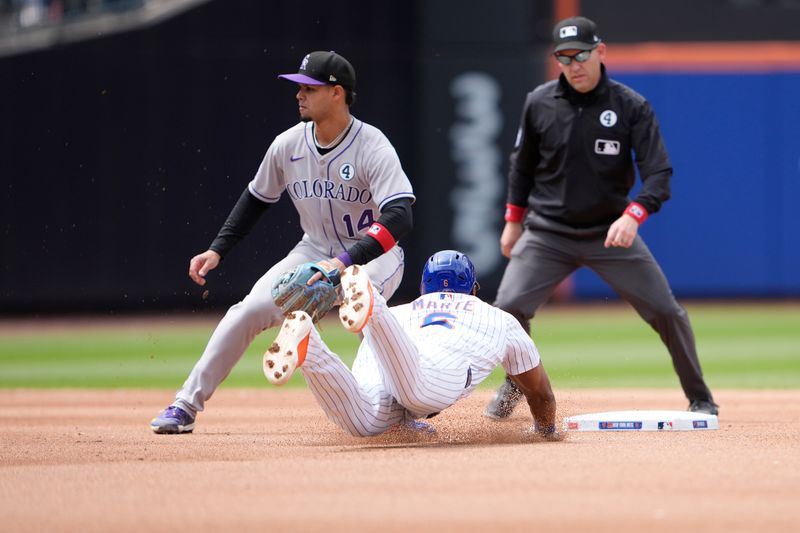 Jun 1, 2025; New York City, New York, USA; New York Mets left fielder Starling Marte (6) steals second base with Colorado Rockies shortstop Ezequiel Tovar (14) waiting for the throw during the fourth inning at Citi Field. Mandatory Credit: Gregory Fisher-Imagn Images