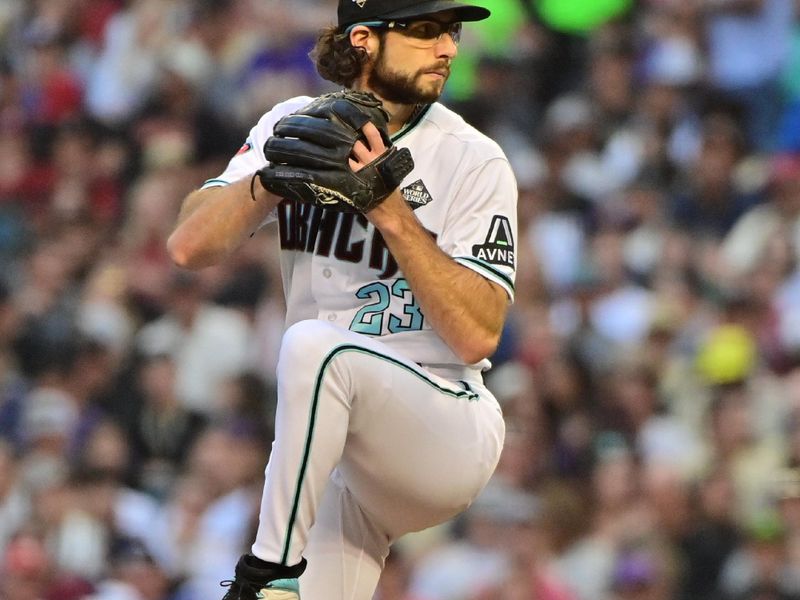 Nov 1, 2023; Phoenix, AZ, USA; Arizona Diamondbacks starting pitcher Zac Gallen (23) pitches in the second inning against the Texas Rangers in game five of the 2023 World Series at Chase Field. Mandatory Credit: Matt Kartozian-USA TODAY Sports