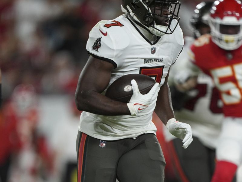 Tampa Bay Buccaneers running back Leonard Fournette (7) rushes with the ball during an NFL football game against the ,Kansas City Chiefs Sunday, October 2, 2022 in Tampa, FL. The Chiefs defeat the Buccaneers 41-31. (Peter Joneleit via AP)