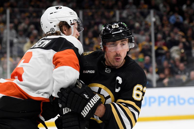 Mar 16, 2024; Boston, Massachusetts, USA; Philadelphia Flyers defenseman Travis Sanheim (6) checks Boston Bruins left wing Brad Marchand (63) during the first period at TD Garden. Mandatory Credit: Bob DeChiara-USA TODAY Sports