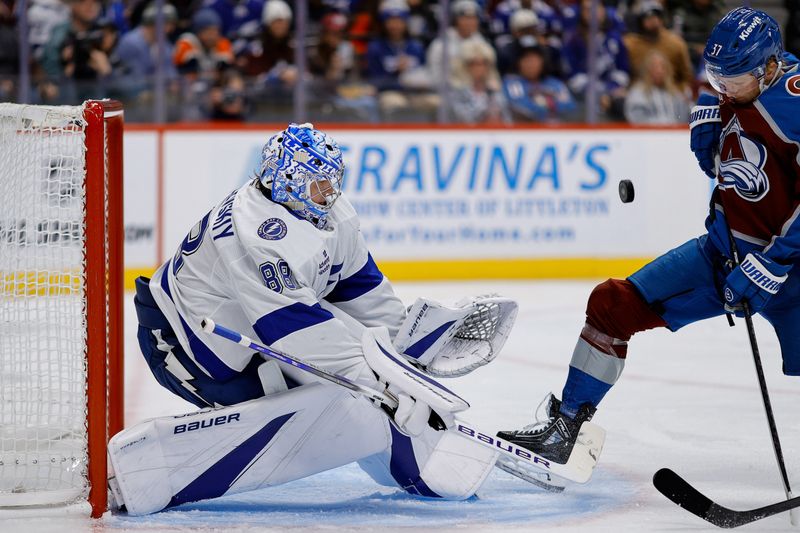 Oct 30, 2024; Denver, Colorado, USA; Tampa Bay Lightning goaltender Andrei Vasilevskiy (88) defends against Colorado Avalanche center Casey Mittelstadt (37) in the second period at Ball Arena. Mandatory Credit: Isaiah J. Downing-Imagn Images