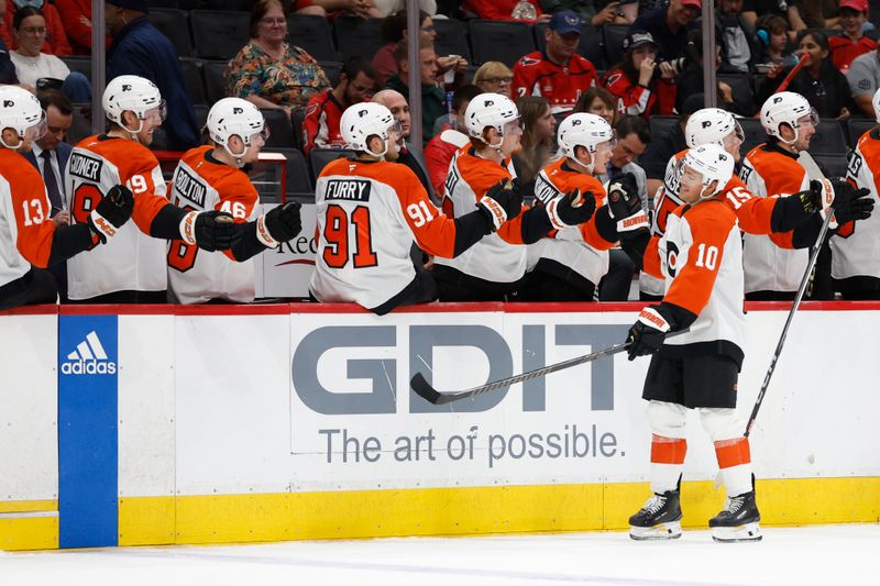 Sep 22, 2024; Washington, District of Columbia, USA; Philadelphia Flyers forward Bobby Brink (10) celebrates with teammates after scoring a goal against the Washington Capitals in the third period at Capital One Arena. Mandatory Credit: Geoff Burke-Imagn Images