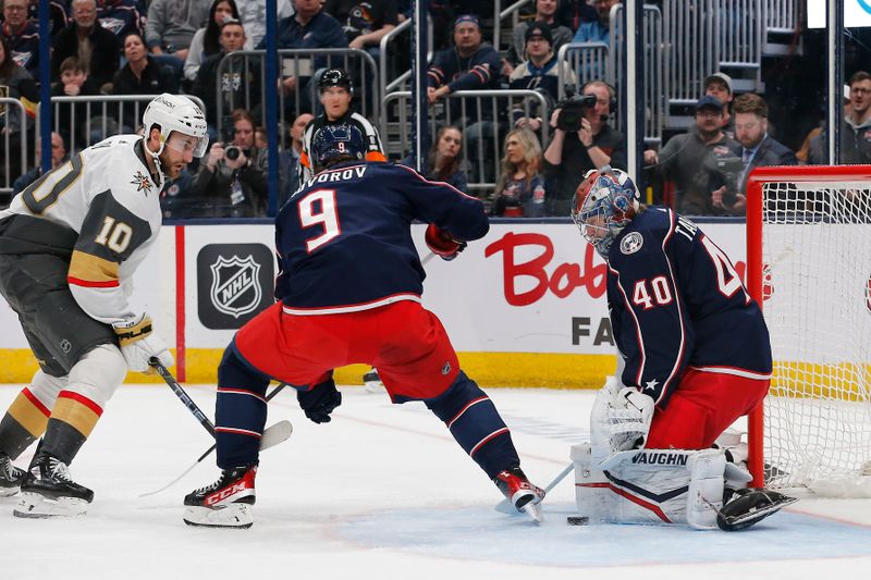 Mar 4, 2024; Columbus, Ohio, USA; Columbus Blue Jackets goalie Daniil Tarasov (40) makes a pad save as Vegas Golden Knights center Nicolas Roy (10) looks for a rebound during the first period at Nationwide Arena. Mandatory Credit: Russell LaBounty-USA TODAY Sports