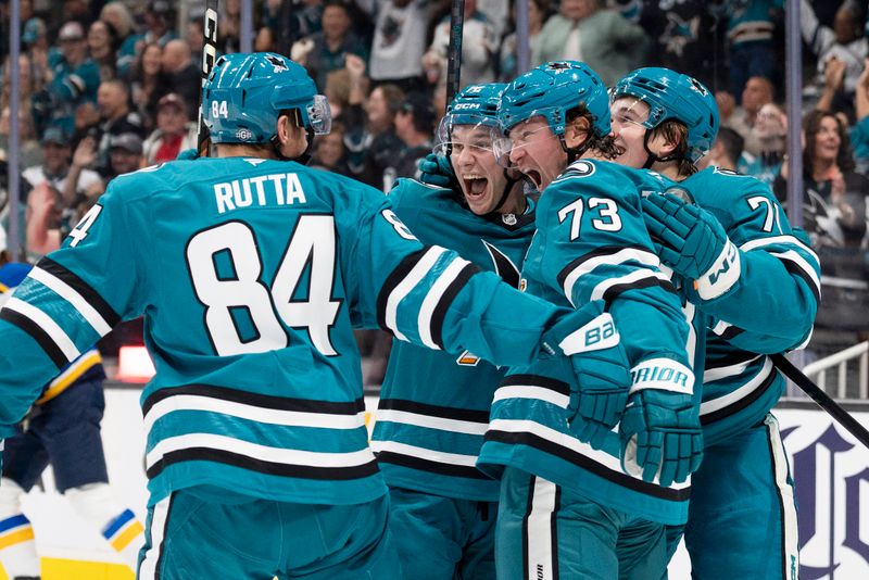 Oct 10, 2024; San Jose, California, USA;  San Jose Sharks left wing William Eklund (72), center Macklin Celebrini (71), and center Tyler Toffoli (73) celebrate with defenseman Jan Rutta (84) during the first period against the St. Louis Blues at SAP Center at San Jose. Mandatory Credit: Stan Szeto-Imagn Images