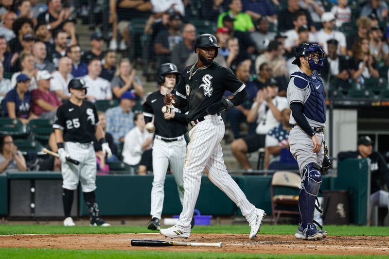 Aug 9, 2023; Chicago, Illinois, USA; Chicago White Sox center fielder Luis Robert Jr. (88) reacts after scoring against the New York Yankees during the third inning at Guaranteed Rate Field. Mandatory Credit: Kamil Krzaczynski-USA TODAY Sports