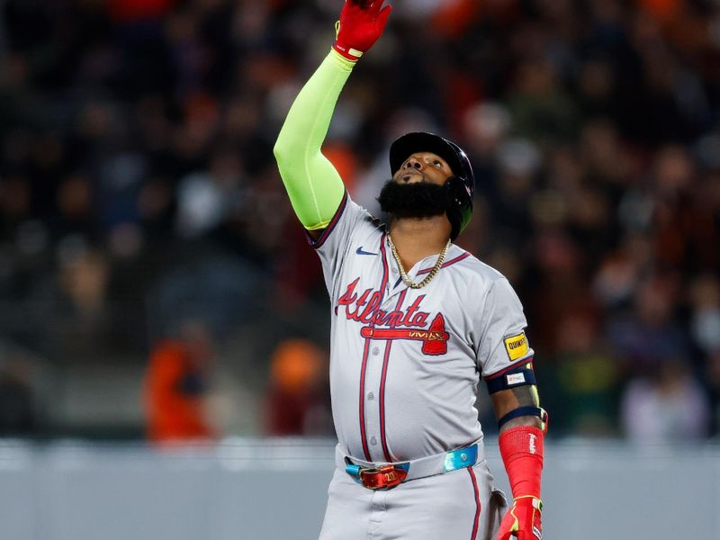 Aug 12, 2024; San Francisco, California, USA; Atlanta Braves designated hitter Marcell Ozuna (20) points to the sky after hitting a double during the seventh inning against the San Francisco Giants at Oracle Park. Mandatory Credit: Sergio Estrada-USA TODAY Sports