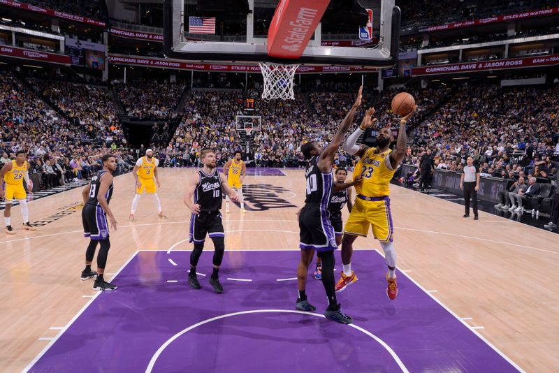 SACRAMENTO, CA - MARCH 13:  LeBron James #23 of the Los Angeles Lakers drives to the basket during the game against the Sacramento Kings on March 13, 2024 at Golden 1 Center in Sacramento, California. NOTE TO USER: User expressly acknowledges and agrees that, by downloading and or using this Photograph, user is consenting to the terms and conditions of the Getty Images License Agreement. Mandatory Copyright Notice: Copyright 2024 NBAE (Photo by Rocky Widner/NBAE via Getty Images)