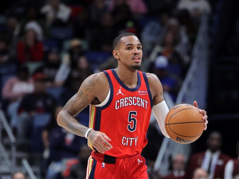 NEW ORLEANS, LOUISIANA - DECEMBER 12: Dejounte Murray #5 of the New Orleans Pelicans drives with the ball against the Sacramento Kings during a game at the Smoothie King Center on December 12, 2024 in New Orleans, Louisiana. NOTE TO USER: User expressly acknowledges and agrees that, by downloading and or using this Photograph, user is consenting to the terms and conditions of the Getty Images License Agreement. (Photo by Jonathan Bachman/Getty Images)