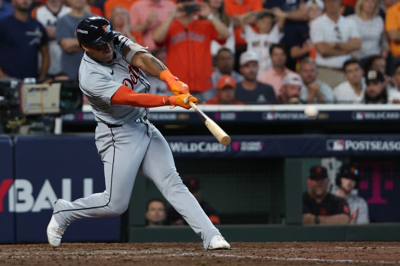 Oct 2, 2024; Houston, Texas, USA; Detroit Tigers second base Andy Ibanez (77) drives in three runs with a triple against the Houston Astros during the eighth inning of game two of the Wildcard round for the 2024 MLB Playoffs at Minute Maid Park. Mandatory Credit: Thomas Shea-Imagn Images