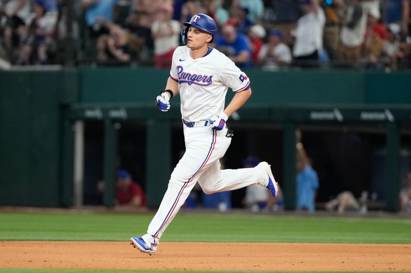 May 29, 2024; Arlington, Texas, USA;  Texas Rangers shortstop Corey Seager (5) circles the bases his two-run home run against the Arizona Diamondbacks during the fifth inning at Globe Life Field. Mandatory Credit: Jim Cowsert-USA TODAY Sports