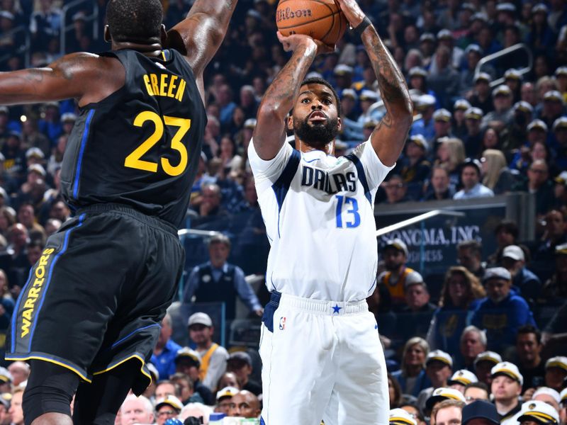 PHOENIX, AZ - NOVEMBER 12: Naji Marshall #13 of the Dallas Mavericks shoots a three point basket during the game against the Golden State Warriors during the Emirates NBA Cup game on November 12, 2024 at Footprint Center in Phoenix, Arizona. NOTE TO USER: User expressly acknowledges and agrees that, by downloading and or using this photograph, user is consenting to the terms and conditions of the Getty Images License Agreement. Mandatory Copyright Notice: Copyright 2024 NBAE (Photo by Barry Gossage/NBAE via Getty Images)