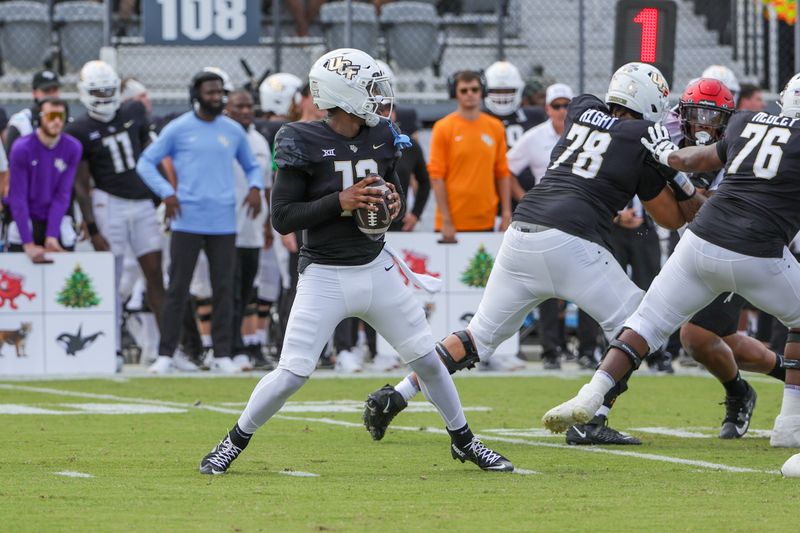 Oct 12, 2024; Orlando, Florida, USA; UCF Knights quarterback EJ Colson (12) looks to pass during the first quarter against the Cincinnati Bearcats at FBC Mortgage Stadium. Mandatory Credit: Mike Watters-Imagn Images