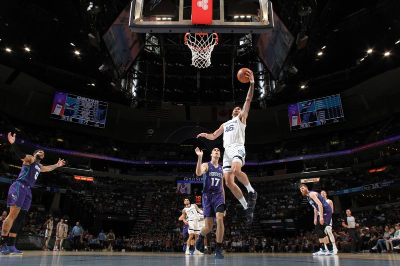 MEMPHIS, TN - MARCH 13: John Konchar #46 of the Memphis Grizzlies drives to the basket during the game against the Charlotte Hornets on March 13, 2024 at FedExForum in Memphis, Tennessee. NOTE TO USER: User expressly acknowledges and agrees that, by downloading and or using this photograph, User is consenting to the terms and conditions of the Getty Images License Agreement. Mandatory Copyright Notice: Copyright 2024 NBAE (Photo by Joe Murphy/NBAE via Getty Images)