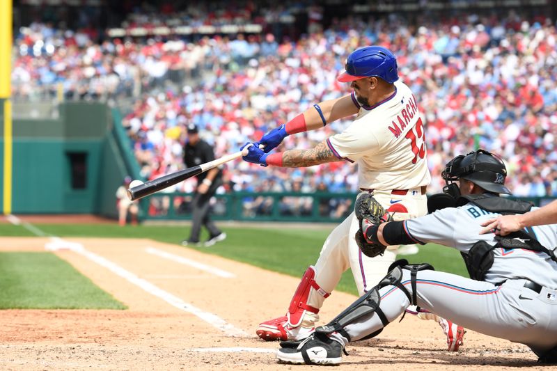 Apr 20, 2025; Philadelphia, Pennsylvania, USA; Philadelphia Phillies catcher Rafael Marchán (13) hits an RBI single during the fourth inning against the Miami Marlins at Citizens Bank Park. Mandatory Credit: Eric Hartline-Imagn Images