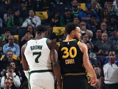 SAN FRANCISCO, CA - DECEMBER 19:  Jaylen Brown #7 of the Boston Celtics and Stephen Curry #30 of the Golden State Warriors looks on during the game on December 19, 2023 at Chase Center in San Francisco, California. NOTE TO USER: User expressly acknowledges and agrees that, by downloading and or using this photograph, user is consenting to the terms and conditions of Getty Images License Agreement. Mandatory Copyright Notice: Copyright 2023 NBAE (Photo by Noah Graham/NBAE via Getty Images)