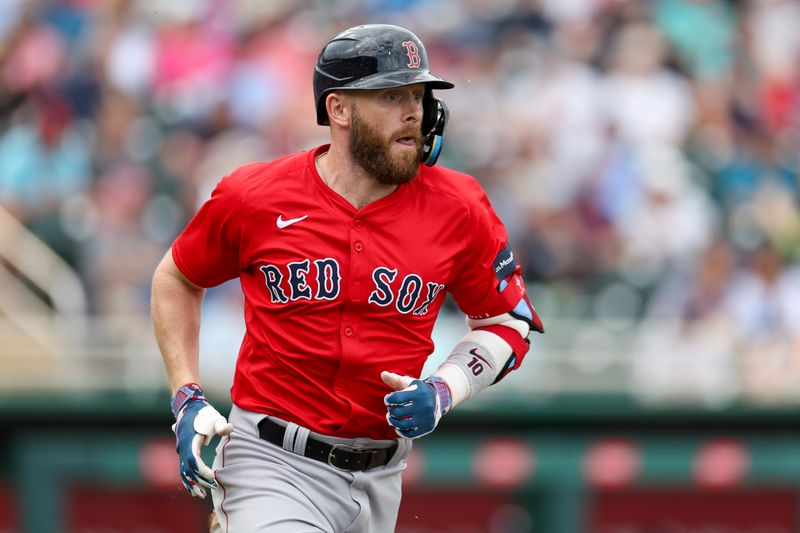 Mar 6, 2024; Fort Myers, Florida, USA;  Boston Red Sox shortstop Trevor Story (10) singles against the Minnesota Twins in the sixth inning at Hammond Stadium. Mandatory Credit: Nathan Ray Seebeck-USA TODAY Sports