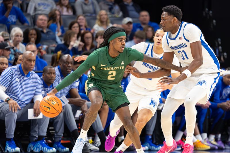 Feb 8, 2026; Memphis, Tennessee, USA; Charlotte 49ers guard Dezayne Mingo (2) handles the ball against Memphis Tigers center Thierno Sylla (31) during the first half at FedExForum. Mandatory Credit: Wesley Hale-Imagn Images