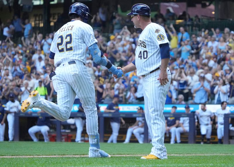 Jun 29, 2025; Milwaukee, Wisconsin, USAt thMilwaukee Brewers outfielder Christian Yelich (22) is congratulated by Milwaukee Brewers third base coach Jason Lane (40) after hitting a home run againstt the Colorado Rockies in sixth inning that American Family Field. Mandatory Credit: Michael McLoone-Imagn Images