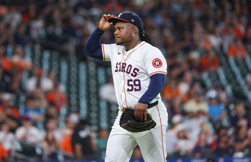 Jul 10, 2024; Houston, Texas, USA; Houston Astros starting pitcher Framber Valdez (59) walks off the mound after pitching during the first inning against the Miami Marlins at Minute Maid Park. Mandatory Credit: Troy Taormina-USA TODAY Sports