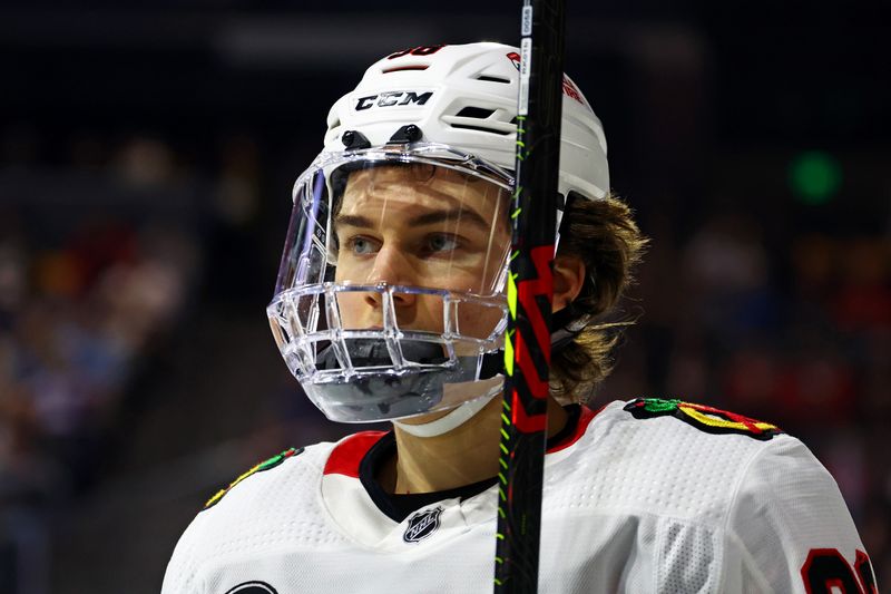 Mar 5, 2024; Tempe, Arizona, USA;  Chicago Blackhawks center Connor Bedard (98) looks on during the second period of the game against the Arizona Coyotes at Mullett Arena. Mandatory Credit: Mark J. Rebilas-USA TODAY Sports