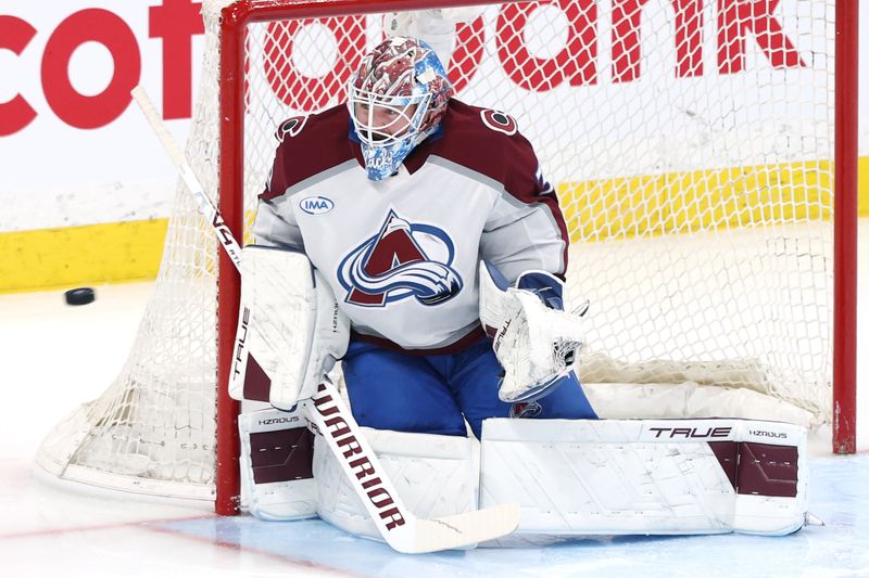 Mar 26, 2026; Winnipeg, Manitoba, CAN; Colorado Avalanche goaltender MacKenzie Blackwood (39) eyes an incoming shot during a game against the Winnipeg Jets in the third period at Canada Life Centre. Mandatory Credit: James Carey Lauder-Imagn Images