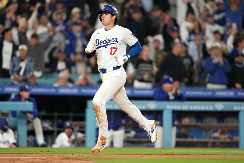 May 21, 2024; Los Angeles, California, USA; Los Angeles Dodgers designated hitter Shohei Ohtani (17) scores in the fourth inning against the Arizona Diamondbacks at Dodger Stadium. Mandatory Credit: Kirby Lee-USA TODAY Sports