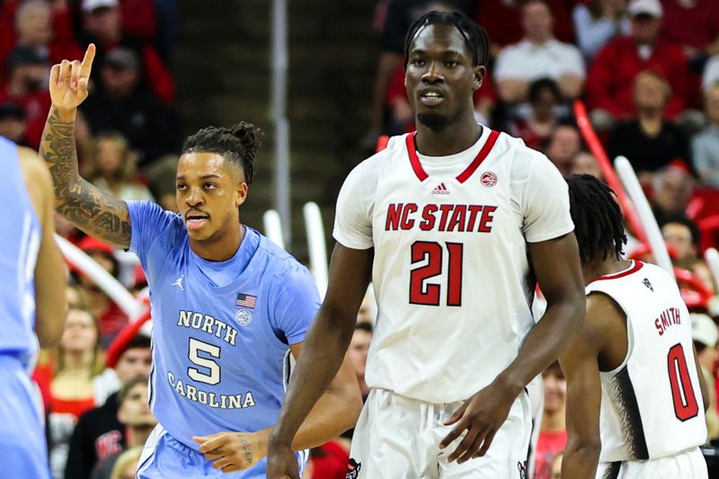 Feb 19, 2023; Raleigh, North Carolina, USA;  North Carolina Tar Heels forward Armando Bacot (5) gestures after scoring a basket during the first half of the game against North Carolina State Wolfpack at PNC Arena. Mandatory Credit: Jaylynn Nash-USA TODAY Sports