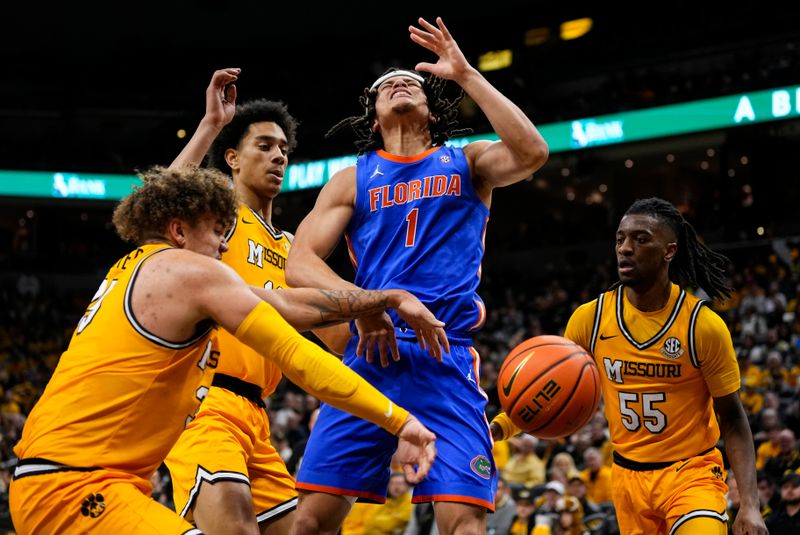 Jan 20, 2024; Columbia, Missouri, USA; Missouri Tigers forward Noah Carter (35) knocks the ball away from Florida Gators guard Walter Clayton Jr. (1) during the second half at Mizzou Arena. Mandatory Credit: Jay Biggerstaff-USA TODAY Sports