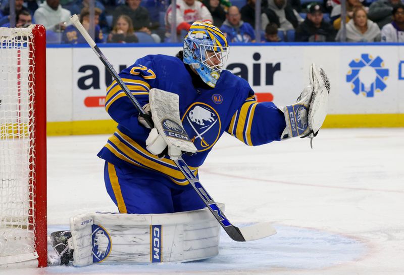 Jan 9, 2024; Buffalo, New York, USA;  Buffalo Sabres goaltender Devon Levi (27) makes a glove save during the third period against the Seattle Kraken at KeyBank Center. Mandatory Credit: Timothy T. Ludwig-USA TODAY Sports